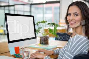 Female graphic designer working at desk