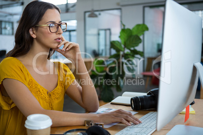 Female graphic designer working on computer