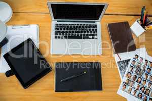 Laptop, graphic tablet and digital tablet on desk