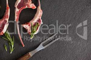 Rib chops, rosemary herb and fork