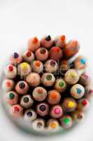 Close-up of colored pencils kept in a glass jar