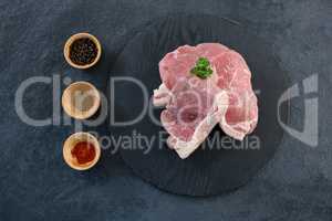 Sirloin chop and bowls of spices