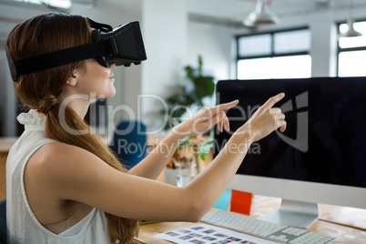 Female graphic designer using the virtual reality headset