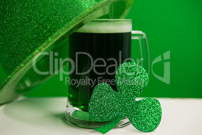 St Patricks Day leprechaun hat with mug of green beer and shamrock