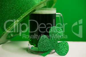 St Patricks Day leprechaun hat with mug of green beer and shamrock