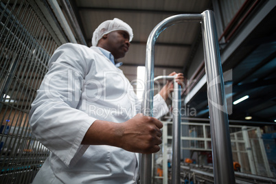 Factory engineer monitoring production line