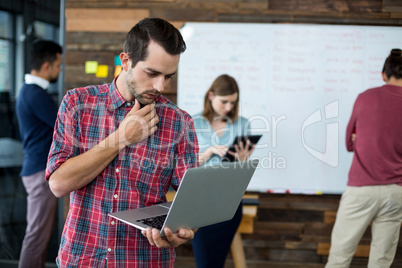 Business executive using laptop