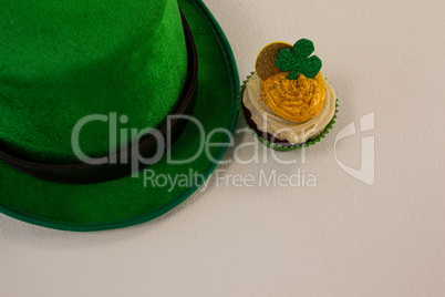 St Patricks Day leprechaun hat with shamrock on cupcake