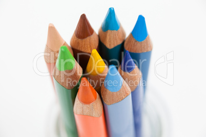 Close-up of colored pencils kept in a glass jar