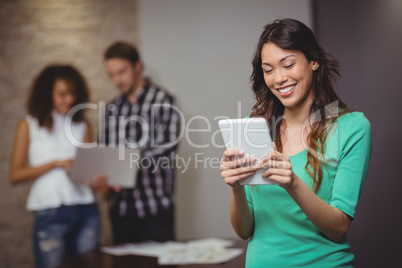 Female executive using digital tablet