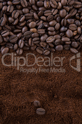 Coffee beans on roasted coffee heap