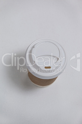 Disposable coffee cup on white background