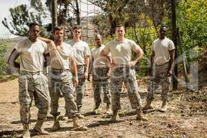 Military soldiers standing near fitness trial