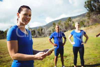 Female trainer using digital tablet