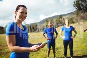 Female trainer using digital tablet