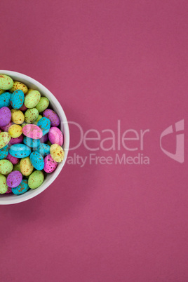 Colorful chocolate Easter eggs in a bowl