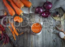 Juice in a mug on a gray wooden surface