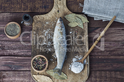 Fresh smelt fish on the kitchen board