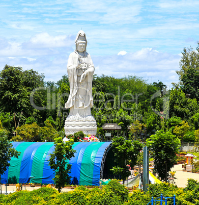 White marble statue of Buddha in the river Kwai valley