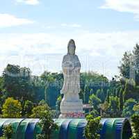 White marble statue of Buddha in the river Kwai valley