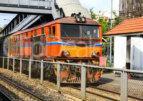Red orange train, Diesel locomotive, on Bangkok railway station