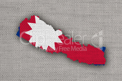 Karte und Fahne von Nepal auf altem Leinen