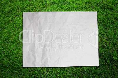 Paper on green grass field