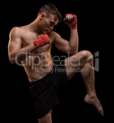 Muscular man with leg up
