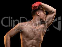 Muscular man kissing biceps