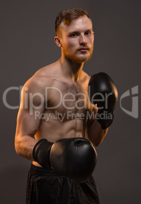 Boxer young man with boxing gloves