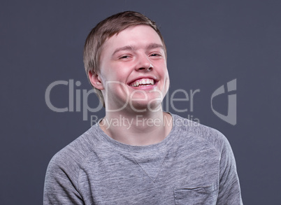 Smiling blond teenage boy