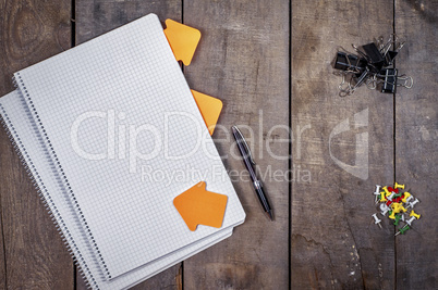 Open empty notebook on a brown wooden surface