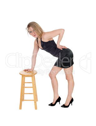 Woman standing on chair.