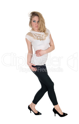 Slim woman standing in black tights.