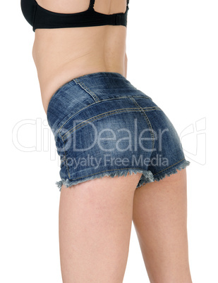 Back of woman in jeans shorts.