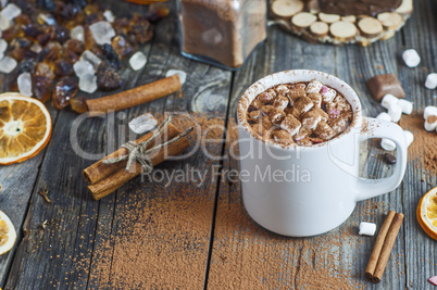 Cocoa drink with marshmallow on a gray wooden surface