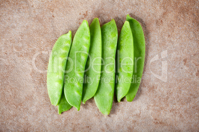 Green peas on ceramic surface