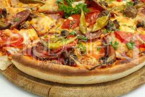 Pizza with sausage, mushrooms and hot pepper.