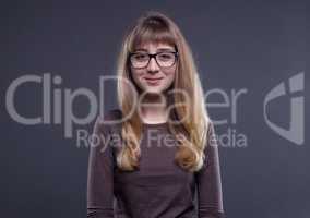 Smiling teenage girl in glasses