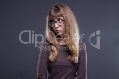 Offended young girl in glasses
