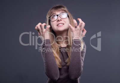 Angry teenage girl in glasses