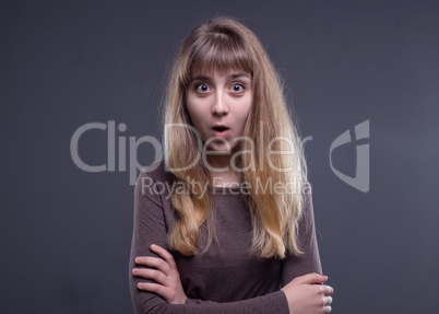 Surprised blond teenage girl