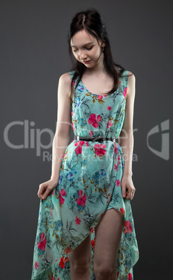 Shy young woman in dress