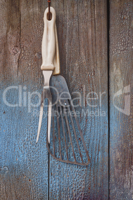Vintage kitchen items hanging on a nail