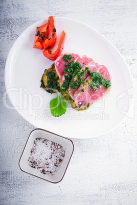 A plate of sliced roast beef