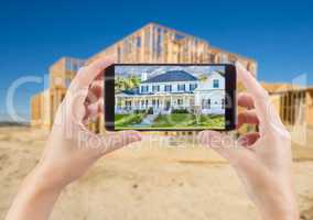 Female Hands Holding Smart Phone Displaying Photo of House with