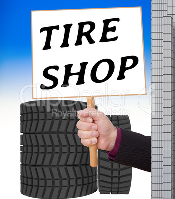 Man holding sign for car tire