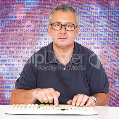 Man sitting at the computer keyboard in front Digital Wall