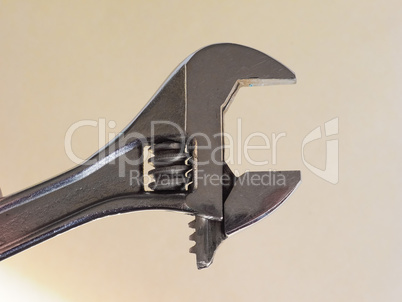 adjustable spanner wrench over brown