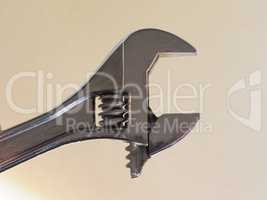 adjustable spanner wrench over brown